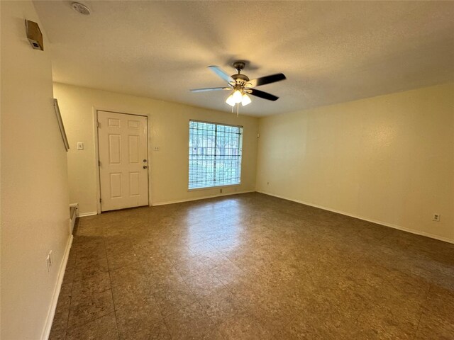 spare room with ceiling fan