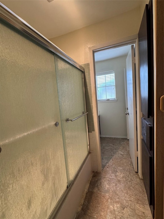 bathroom featuring enclosed tub / shower combo