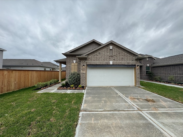 ranch-style home featuring a front lawn, fence, driveway, and brick siding