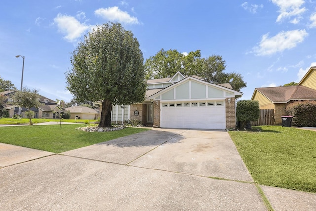 view of front of house with a front yard and a garage