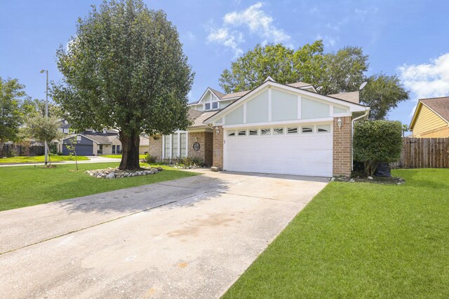 view of front facade featuring a front lawn and a garage