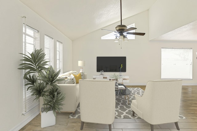 living room with hardwood / wood-style floors, ceiling fan, a textured ceiling, and vaulted ceiling