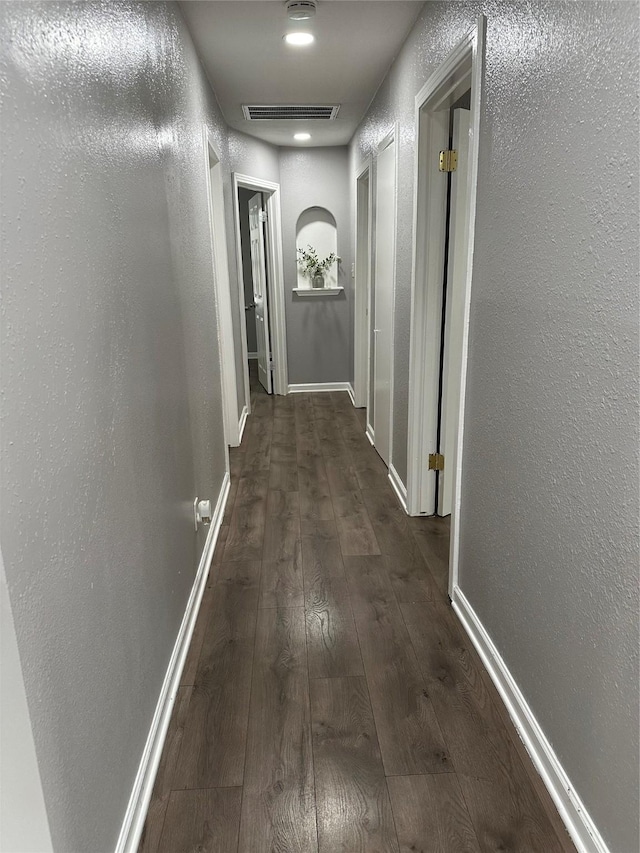 hallway featuring dark hardwood / wood-style floors