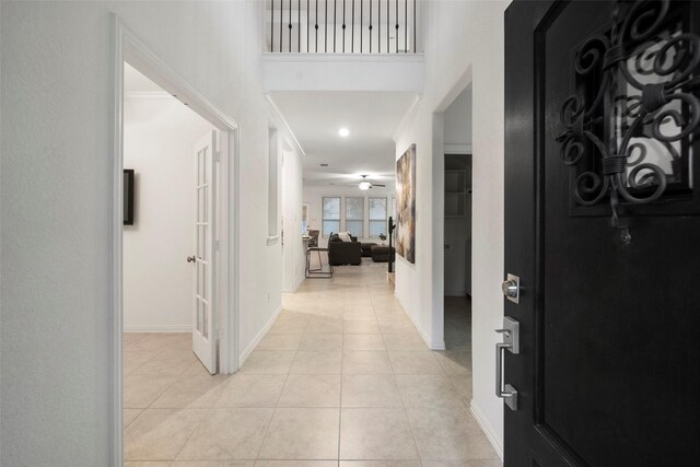 hall with light tile patterned flooring