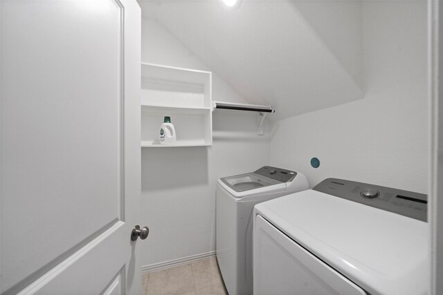 laundry area featuring washing machine and clothes dryer