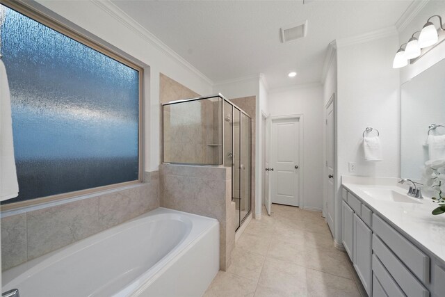 bathroom featuring tile patterned floors, vanity, shower with separate bathtub, and crown molding