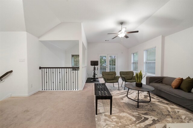 living room with carpet flooring, ceiling fan, and vaulted ceiling