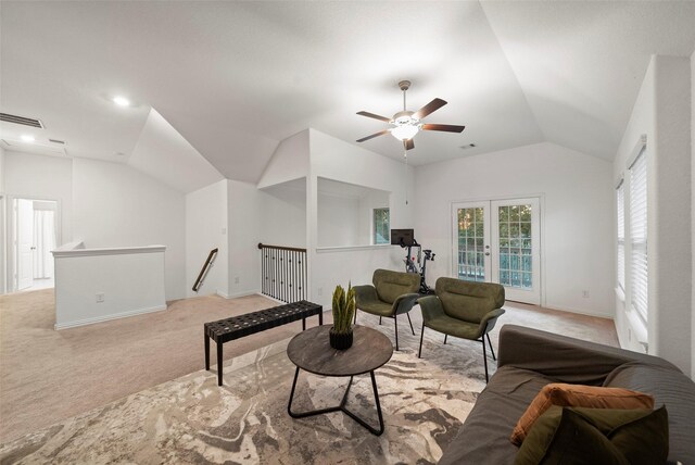 living room featuring ceiling fan, french doors, light colored carpet, and lofted ceiling