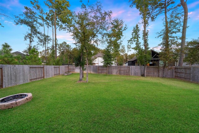 view of yard at dusk