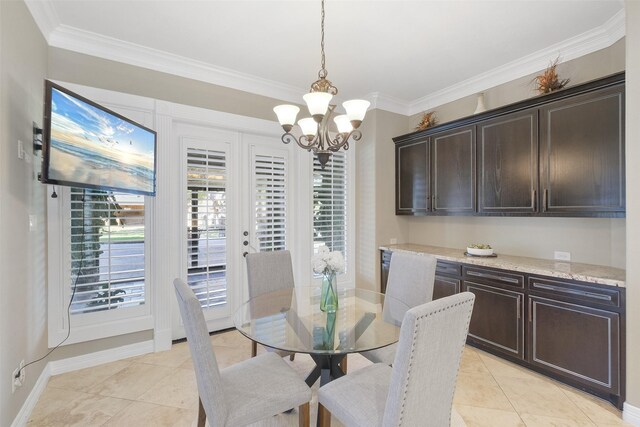 dining area featuring light tile patterned floors, a notable chandelier, and ornamental molding