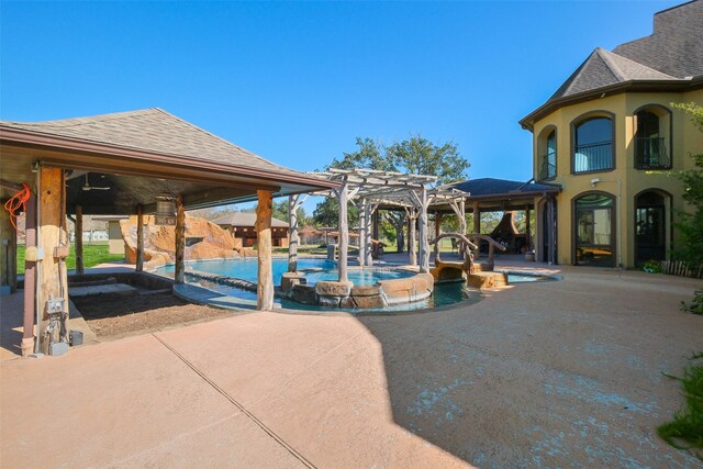 view of swimming pool featuring a patio area and a pergola