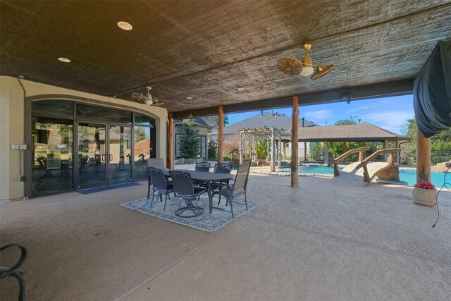 view of patio featuring ceiling fan