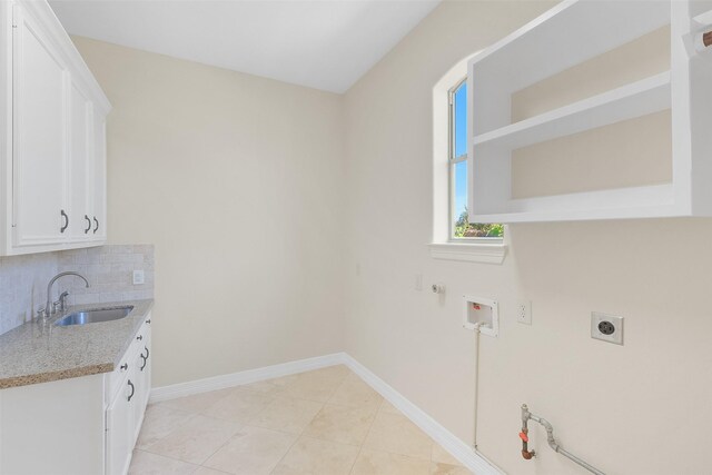 laundry area with cabinets, hookup for a gas dryer, sink, hookup for a washing machine, and hookup for an electric dryer