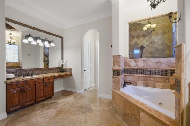 bathroom featuring crown molding, vanity, and a relaxing tiled tub