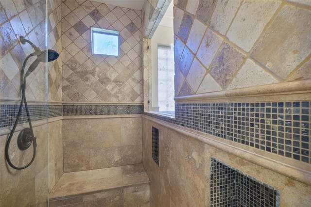 bathroom with tiled shower