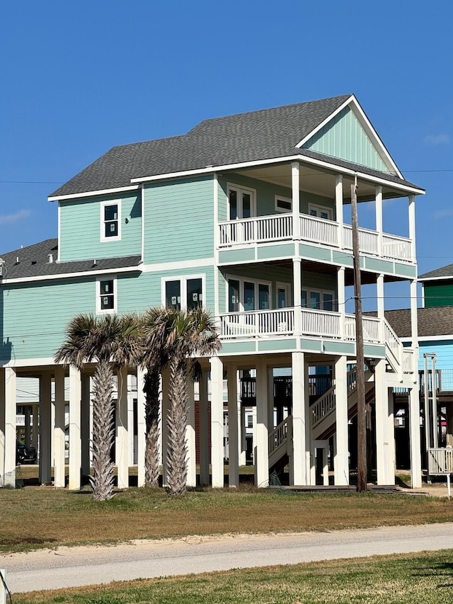 view of property featuring stairway and a carport