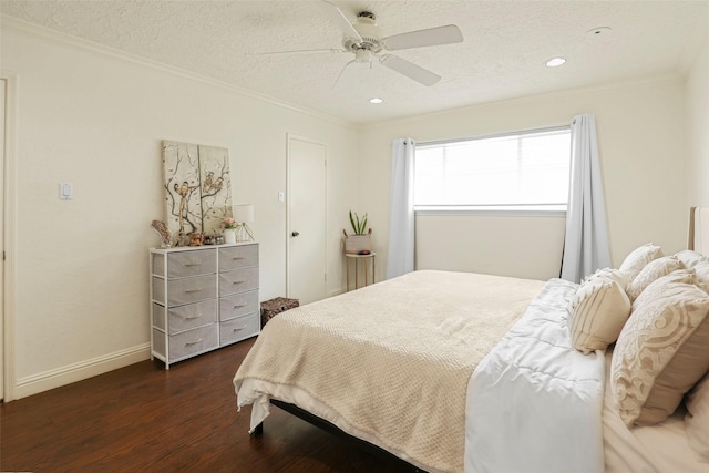 bedroom featuring a textured ceiling, dark hardwood / wood-style floors, ceiling fan, and ornamental molding