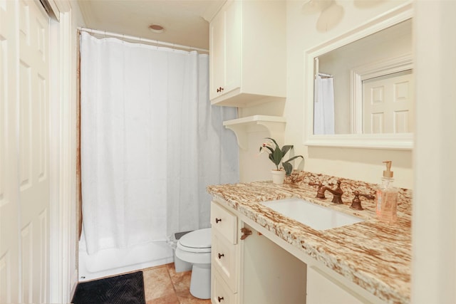 full bathroom with tile patterned flooring, vanity, shower / bath combo, and toilet