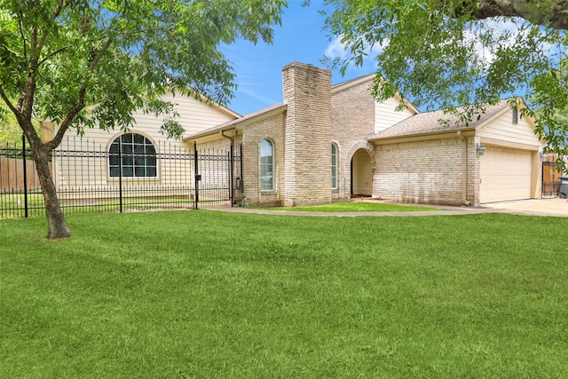 view of front of home with a garage and a front yard