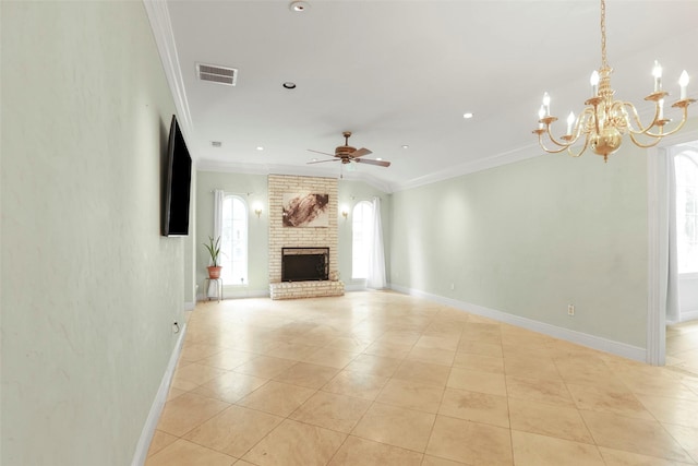 unfurnished living room featuring ceiling fan with notable chandelier, ornamental molding, a fireplace, and light tile patterned floors