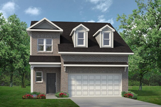 view of front of home with a garage and a front lawn