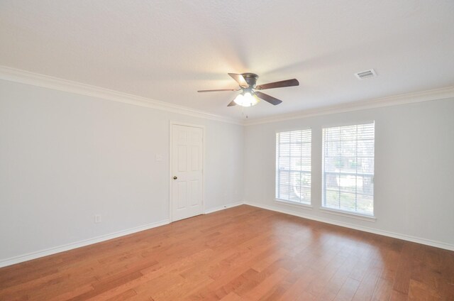 unfurnished room featuring light hardwood / wood-style flooring, ceiling fan, and ornamental molding