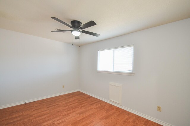 spare room with light hardwood / wood-style floors and ceiling fan