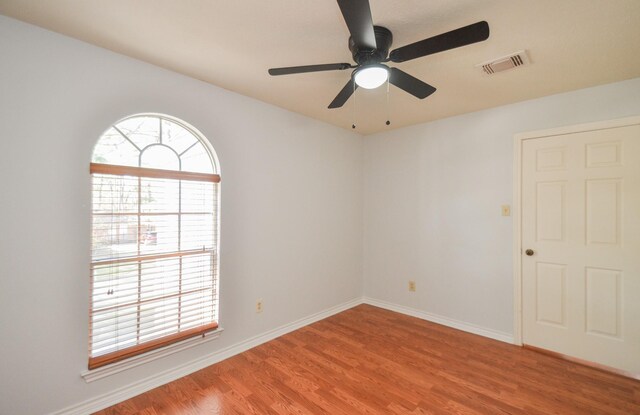 unfurnished room featuring ceiling fan and light hardwood / wood-style floors