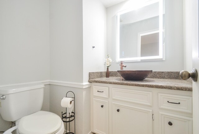 bathroom with vanity and toilet