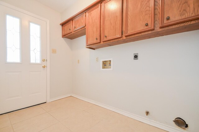 laundry room featuring cabinets, washer hookup, hookup for an electric dryer, gas dryer hookup, and light tile patterned flooring