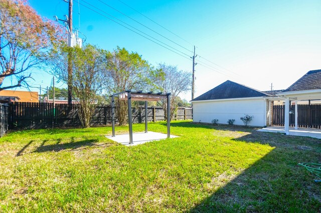 view of yard with a pergola and a patio area