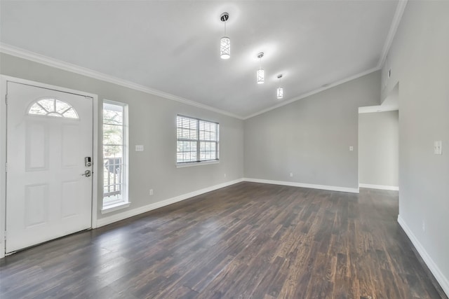 entrance foyer with dark hardwood / wood-style flooring and crown molding