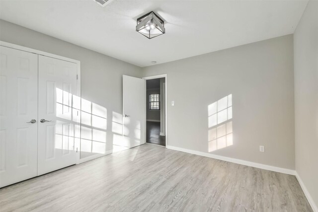 empty room featuring light hardwood / wood-style floors