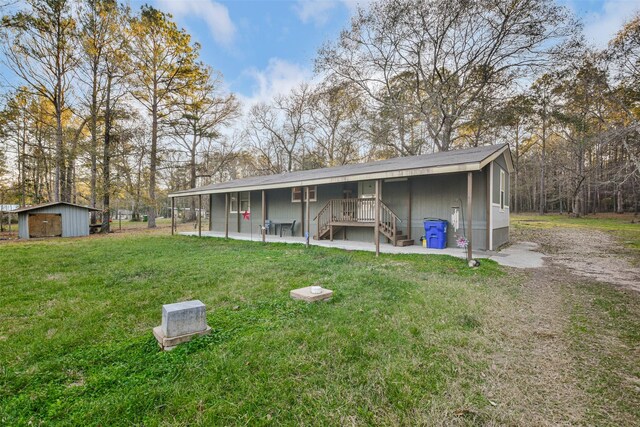 exterior space featuring an outbuilding and a lawn