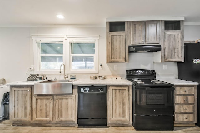 kitchen featuring sink and black appliances