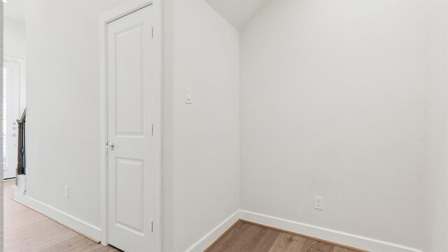 interior space with light hardwood / wood-style flooring and lofted ceiling