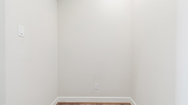 spare room with hardwood / wood-style floors