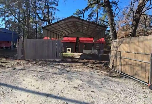 view of vehicle parking with a carport