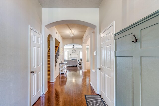 corridor featuring dark hardwood / wood-style flooring