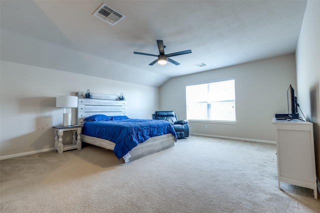 bedroom featuring ceiling fan, light carpet, and vaulted ceiling