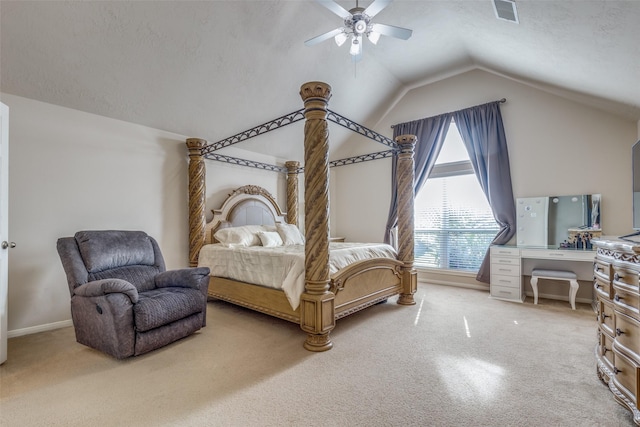 carpeted bedroom featuring a textured ceiling, ceiling fan, and lofted ceiling