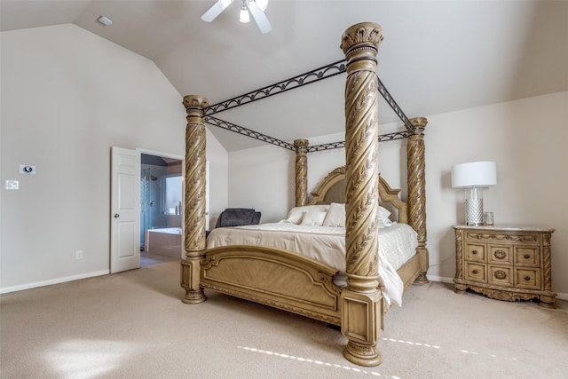 carpeted bedroom with vaulted ceiling, ensuite bath, and ceiling fan