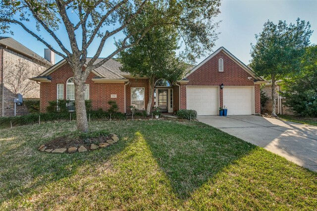 view of front of house with a front lawn and a garage