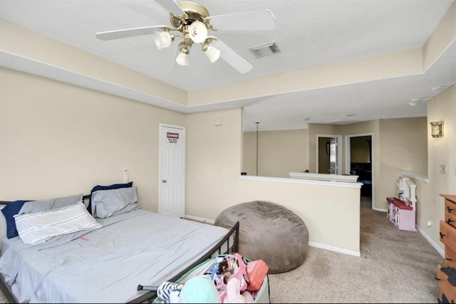 bedroom featuring ceiling fan and light colored carpet