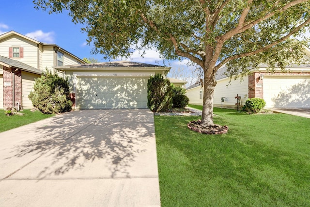 front of property with a garage and a front yard