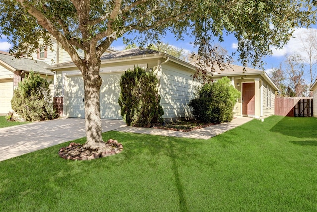 view of front of property with a front yard and a garage