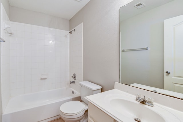 full bathroom featuring vanity, toilet, and tiled shower / bath