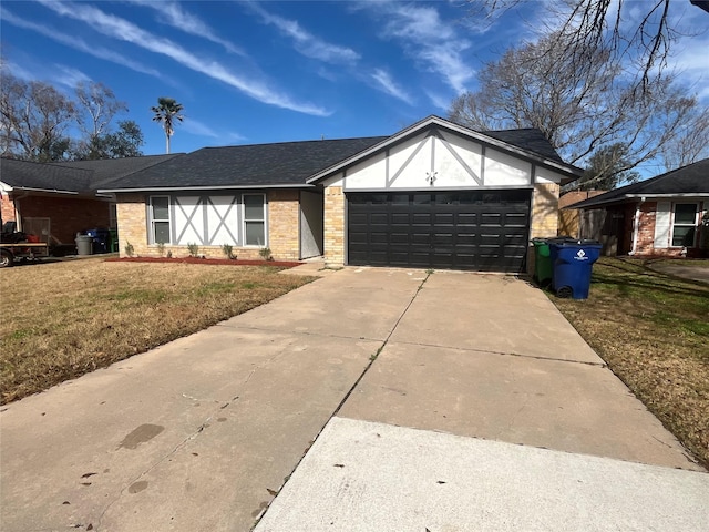 view of front of home featuring a garage and a front lawn