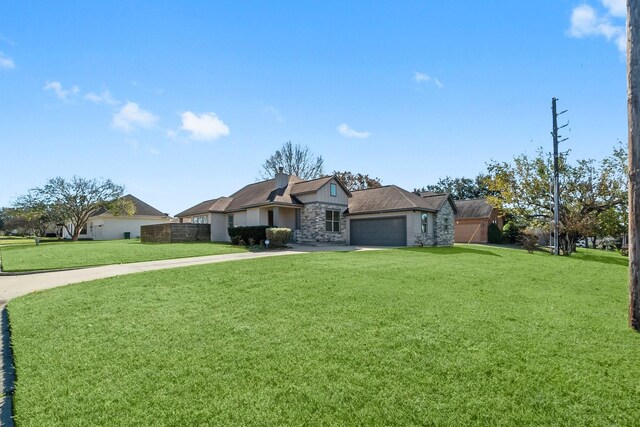 ranch-style home featuring a garage and a front lawn