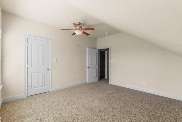 interior space featuring carpet floors, ceiling fan, and lofted ceiling